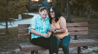 Mother and daughter smiling